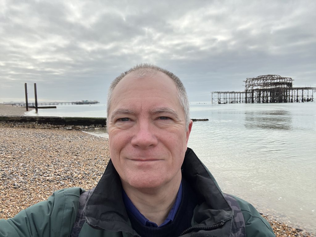 Neil Daws on Brighton beach by the West Pier